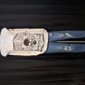 White Graphic Skull T-Shirt and Distressed Blue Jeans